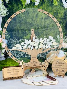 a table topped with two wooden cards and a tree