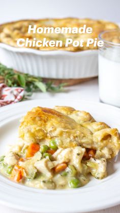 homemade chicken pot pie on a white plate with a glass of milk in the background