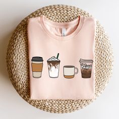 "BOHO COFFEE BELLA+CANVAS UNISEX TEE **IMPORTANT** These are print-on-demand tees, so please keep in mind that they can take up to 2-7 business days to be fulfilled and 3-6 business days to be shipped.  Sometimes fulfillment can happen very quickly and sometimes longer than usual. The typical turnaround for production and shipping is 8 days. The Bella Canvas 3001 T-shirts are one of the most popular standard-weight unisex shirts in the world. They're made of ring-spun cotton which makes them sof Coffee Statement Shirt, Cheap Coffee-colored T-shirt With Text Print, Coffee T Shirts, Coffee T Shirt, Coffee Shop Merchandise, Coffee Shirt, Cafe Merch, Coffee Shirt Ideas, Coffee Merch