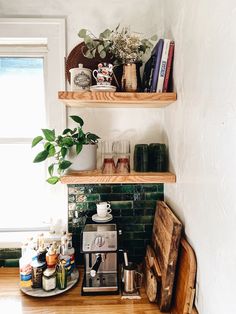 the kitchen counter is cluttered with coffee, tea and condiments on it