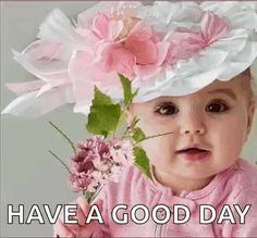 a baby girl wearing a white hat with pink flowers on it's head and the words, born dia