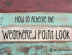 the words how to achieve the weathered paint look are painted on wooden planks with black lettering