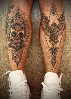 a pair of legs with tattoos on them