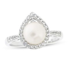 This lovely ring for her features a lustrous freshwater cultured pearl in a simply elegant silhouette. A teardrop surround of sparkling white lab-created sapphires and along the band add extra shimmer and shine and the perfect finishing touch. The ring is styled in sterling silver. Pearl Engagement Rings, Iconic Wedding Dresses, Black Pearl Ring, Crystal Engagement Rings, Pearl Engagement Ring, Black Engagement Ring, Rose Gold Pearl, Pearl And Diamond Ring, White Lab