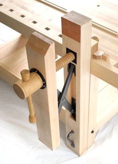 a wooden workbench with tools attached to it