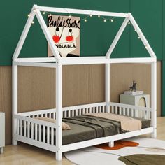 a white bunk bed with a canopy and lights on the top, in front of a green wall