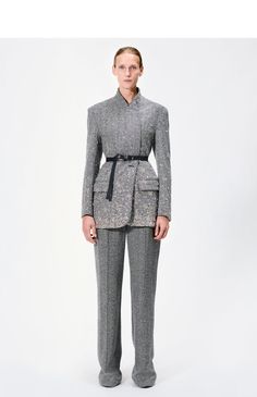 A modern take on the classic tuxedo jacket, this piece is meticulously crafted from 100% Italian wool herringbone in a sharp black and ivory hue. Intricate hand-embroidered crystals adorn the jacket, creating a striking pattern that elevates its timeless design. Featuring a horn button closure and two side pockets, this jacket combines elegant tailoring with a contemporary twist. Style Number: F24801WH Made in New York City Size & FitModel's Height: 5'10"Model is wearing size small Composition & Tailored Embellished Outerwear With Notch Lapel, Glamorous Tailored Long Sleeve Suits, Luxury Embellished Outerwear With Notch Lapel, Tailored Embellished Blazer For Work, Luxury Tailored Embellished Outerwear, Luxury Embellished Outerwear For Work, Luxury Embellished Workwear Outerwear, Glamorous Tailored Outerwear With Notch Lapel, Fall Embellished Outerwear With Notch Lapel