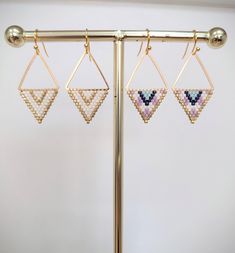 Glass beads woven onto brass triangles with gold plated ear wires Gold Beaded Geometric Earrings, Geometric Beaded Gold Earrings, Gold Geometric Beaded Earrings, Gold Triangle Beaded Bohemian Earrings, Geometric Gold Beaded Earrings, Stitch Earrings, Brick Stitch Earrings, Triangle Earrings, Brick Stitch