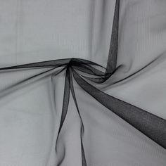 black and white sheer fabric with thin lines on it's sides, as well as the