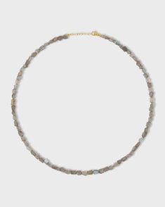 This exquisite piece of jewelry is handmade in NYC, featuring a gorgeous labradorite gemstone bead in a luxurious 14k gold setting. With its iridescent hues of blue, green, and gold, the labradorite gemstone is known for its mystical properties that promote intuition and spiritual awareness. This necklace adds a touch of elegance to any outfit, whether you're dressing up for a special occasion or adding a pop of glamour to your everyday wear. 14 Karat Yellow Gold Labradorite, 72 carats 18 to 19 Gold Labradorite Necklace With Gemstone Beads, Gold Labradorite Crystal Necklace With Gemstone Beads, Gold Beaded Necklace With Labradorite Stones, Gold Crystal Necklaces With Gemstone Beads, Spiritual Labradorite Necklaces With Raw Stone, Spiritual Labradorite Necklace With Raw Stone, Gold Labradorite Gemstone Beaded Necklace, Spiritual Labradorite Jewelry With Gemstone Beads, Gold Labradorite Necklaces With Natural Stones