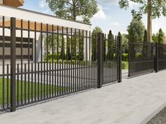 a black iron fence next to a white building