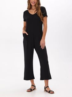 Introducing our Rainey Modal Terry Short Sleeve Jumpsuit, a revamped version of our best-selling Rainey Jumpsuit. With added sleeves and a new fall-inspired design, stay comfortable and stylish in this versatile piece. Perfect for any occasion, this jumpsuit will surely become your go-to outfit! Versatile Black Stretch Jumpsuits And Rompers, Black Relaxed Fit Jumpsuits And Rompers For Loungewear, Fitted Black Jumpsuit For Lounging, Versatile Black V-neck Jumpsuits And Rompers, Black Lounging Jumpsuits And Rompers For Spring, Black Stretch Jumpsuits And Rompers With Pockets, Black Relaxed Fit Jumpsuits And Rompers, Black Stretch Jumpsuit With Pockets, Black Relaxed Fit Overalls And Jumpsuits