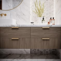 a bathroom with marble counter tops and wooden cabinets