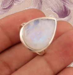 #Mother's Day gift items925 Sterling Silver Natural Rainbow Moonstone Pear Shape Gemstone Ring. Available in different size. Gemstone Name: Natural Rainbow Moonstone Metal: 925 Sterling Silver Ring Size: Optional Quantity: 1 Piece click more rainbow moonstone rings:- https://www.etsy.com/your/shops/Shreejaipursilver925/tools/listings/query:rainbow%20moonstone%20ring,stats:true Rainbow moonstone is thought to bring balance, harmony and hope while enhancing creativity, compassion, endurance and in Gift Moonstone Ring In Sterling Silver, Silver Moonstone Ring With Natural Stones For Gift, Silver Moonstone Ring As A Gift, Teardrop Moonstone Ring As A Gift, Handmade Moonstone Ring Gift, Silver Moonstone Birthstone Ring Gift, Silver Moonstone Ring Ideal For Gifts, Handmade Oval Moonstone Ring Gift, Teardrop Moonstone Birthstone Ring As Gift