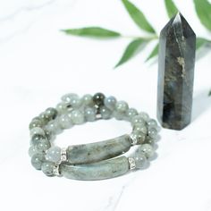 This beaded bracelet is made of natural Labradorite gemstone and has a beautiful heart charm. Labradorite has a pearly sheen and some specimens have a shimmer effect. Our Gemstone Beaded Bracelets are designed to feel lightweight, comfortable, and effortless.Stringing each natural stone is part of our mindful Intention when we create this beaded bracelet, infusing positive energies, love, and happiness within each design.We combine meaningful symbols and natural gemstones giving this one accesso Moonstone Bracelets With Natural Stones For Healing, Healing Moonstone Bracelet With Natural Stones, Healing Labradorite Beaded Bracelets With 8mm Beads, Labradorite Bracelets With Natural Stones For Healing, Adjustable Labradorite Spiritual Crystal Bracelet, Spiritual Labradorite Beaded Bracelets As Gift, Spiritual Labradorite Bracelets As Gift, Hand Wrapped Labradorite Bracelets As Gift, Spiritual Labradorite Crystal Bracelet Gift