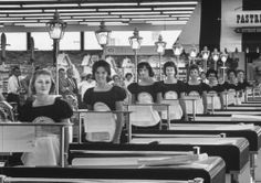 black and white photograph of women in an assembly line