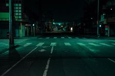 an empty city street at night with no traffic