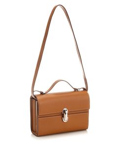 "Symmetry 19" slim handbag from Savette in tan brown leather, with shiny gold metal twist lock and internal side pocket. Composition: 100% Calfskin Modern Brown Satchel With Turn-lock Closure, Rectangular Cognac Shoulder Bag With Silver-tone Hardware, Cognac Rectangular Shoulder Bag With Silver-tone Hardware, Cognac Shoulder Bag With Silver-tone Hardware, Luxury Cognac Shoulder Bag With Silver-tone Hardware, Modern Cognac Bags With Silver-tone Hardware, Elegant Brown Satchel With Silver-tone Hardware, Evening Bags In Cognac With Palladium Hardware, Luxury Cognac Satchel With Turn-lock Closure