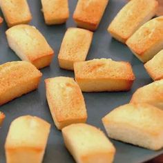 several pieces of cake sitting on top of a pan