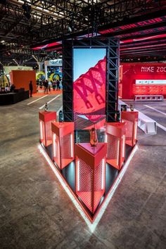 an exhibit area with red and black lighting