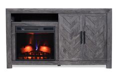 an entertainment center with a fireplace in the middle and doors open to reveal fire inside