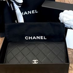 This Yen Wallet From Chanel Is A Wonderful Creation! This Black Wallet Is Crafted From Lambskin Leather And Features The Signature Quilted Pattern All Over The Exterior Along With The Cc Logo To The Front. The Bi-Fold Piece Opens To A Leather And Fabric Interior That Houses Multiple Card Slots And Open / Zipper Compartments. Pre-Owned, In Very Good Condition. Please See All Photos For Further Details And Ask Questions If You Have Any Before Purchasing. Thank You Width (Inch) : 7.08 Inch(Approx) Width (Cm) : 18 Cm(Approx) Height (Inch) : 3.93 Inch(Approx) Height (Cm) : 10 Cm(Approx) Depth (Inch) : 0.78 Inch(Approx) Depth (Cm) : 2 Cm(Approx) Color: Black Material: Lambskin Leather Comes Modern Black Wallet With Dust Bag, High-end Black Wallet For Everyday Use, Luxury Black Wallet For Gift, High-end Leather Wallet For Formal Occasions, Luxury Black Wallets For Formal Occasions, High-end Black Rectangular Wallet, Luxury Leather Clutch Wallet, Black Luxury Rectangular Wallet, Designer Leather Wallet