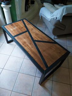 a coffee table made out of wood and metal