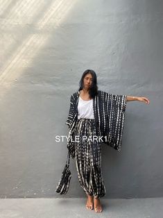 Traditional Summer Wrap Kaftan, Traditional Summer Kimono For Vacation, Bohemian Black Sets For Spring, Black Bohemian Sets For Spring, Traditional Summer Kimono In Free Size, Traditional Summer Kimono Free Size, Black Cotton Kimono For Summer, Traditional Summer Sets With Kimono Sleeves, Black Relaxed Fit Sets For Vacation