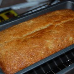 a loaf of bread sitting on top of a metal rack