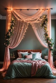 a bed covered in pink and green sheets next to a window with lights on it