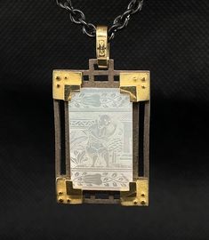 This pendant features an original antique mother-of-pearl Chinese gambling counter that has been finely engraved with a beautiful scene depicting life in 18th Century China. These gaming counters were carved in China for export to Britain, where they were used in games the way we use poker chips. Each gaming counter is set in a handmade 18k yellow gold and blackened silver mounting inspired by the architecture of Ancient China. Handmade by our jewelers in Los Angeles, this is a real conversation Artisan Engraved Necklace For Collectibles, Engraved Mother Of Pearl Pendant Necklace, Antique Intaglio Pendant Jewelry, Antique Rectangular Carved Jewelry, White Engraved Amulet Style Jewelry, Luxury Carved Pendant Necklace, White Engraved Amulet Jewelry, Antique Engraved Rectangular Necklace, Antique Rectangular Engraved Necklace