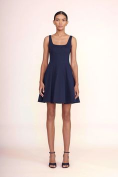 Our classic Wells Dress in a 'mini' update. The Mini Wells Dress features a corset-style panel construction to create a flattering, fitted shape through the waist and a mini-length a-line skirt. Made out of lightweight cotton poplin. Chic Navy A-line Mini Dress, Classic Mini Dress With Fitted Bodice For Cocktail, Classic Mini Dress With Flattering Silhouette, Chic Navy Fitted Mini Dress, Classic A-line Mini Dress With Fitted Bodice, Fitted Bodice Mini Dress For Work, Fitted Navy Mini Dress For Formal Occasions, Navy Fitted Mini Dress For Formal Occasions, Classic Navy A-line Dress