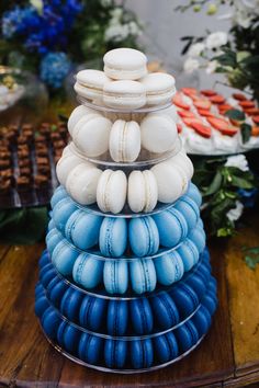 blue and white macaroons stacked on top of each other