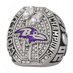 the baltimore ravens super bowl ring is shown in purple and white with crystals on it