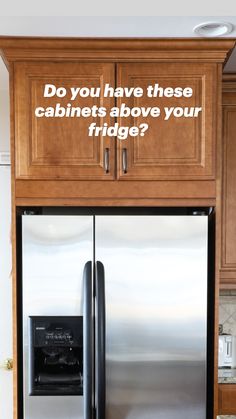 a stainless steel refrigerator with wooden cabinets in a kitchen