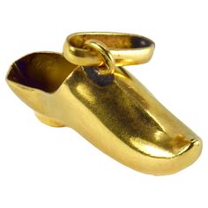 A French 18 karat (18K) yellow gold charm pendant designed as a shoe. Stamped with the eagles head for French manufacture and 18 karat gold with an unknown maker’s mark. Dimensions: 1 x 1.8 x 0.55 cm (not including jump ring) Weight: 0.78 grams Gold Shoe, The Eagles, Gold Shoes, Cross Charms, Pendant Design, Shoe Charms, Rose Cut Diamond, Star Charms, Gold Charm