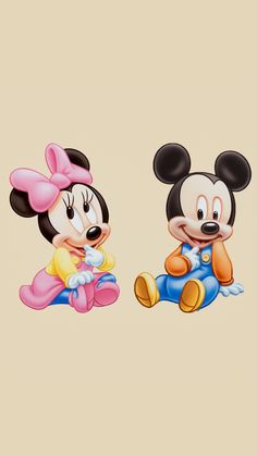 two mickey and minnie mouses sitting next to each other on a beige background,