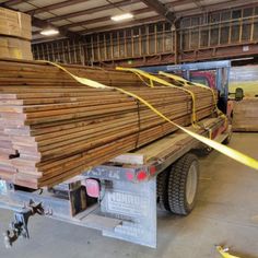 a truck is loaded with lumber in a warehouse