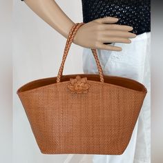 Beautifully Made Paolo Masi Handbag. Pretty Caramel-Colored Intricately Woven Leather. Leather Flower Adds A Feminine Touch. Double Handle Is Woven As Well. Detailed Stitching. Large Interior Zippered Compartment That Separates Two Sides. Another Zip Pocket On The Side. Fully Lined. Feet On The Bottom For Support. Excellent Condition. 16”W X 9”H X 7-1/2”D. Classic Natural Bags With Braided Handles, Classic Natural Bag With Braided Handles, Classic Natural Shoulder Bag For Shopping, Elegant Straw Bag With Large Capacity And Double Handle, Classic Natural Bags With Leather Handles, Luxury Rectangular Straw Bag With Rolled Handles, Elegant Large Capacity Straw Bag With Double Handles, Elegant Large Capacity Double Handle Straw Bag, Classic Natural Rectangular Shoulder Bag