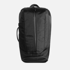 the back view of a black backpack with zippers