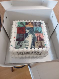 a cake in a box with photos on it