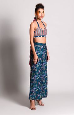 Editor's Note Featuring Rv's Signature Tropical print On Pants Paired With Bralet Adorned With Embroidery Color: Teal Fabric: Crepe, Dupion Care: Dry Clean Only About the Designer Rishi & Vibhuti label combines traditional elements with modern aesthetic uniquely to create chic occasion wear for women with a fine choice. The global appeal in their designs has made Rishi & Vibhuti one of the sought-after labels in a short span of time. Summer Festive Floral Print Pants, Summer Straight Pants With Printed Motifs, Green Festive Summer Pants, Festive Green Summer Pants, Summer Festive Green Pants, Festive Green Embroidered Bottoms, Summer Festive Pants With Floral Embroidery, Summer Festive Floral Embroidery Pants, Fitted Pant Set With Printed Motifs For Summer