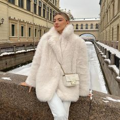 Fluffy Faux Fur Outerwear For Spring, Elegant Fluffy Winter Outerwear, Trendy Long Faux Fur Coat, Trendy Fluffy Fur Coat For Cold Weather, Chic Faux Fur Winter Coat, Chic Winter Faux Fur Coat, Long Fur Coat With Faux Fur Lining For Fall, Chic Cold Weather Fur Coat With Faux Fur Trim, Fall Long Coat With Faux Fur Lining