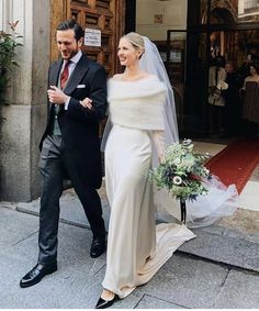 the bride and groom are walking out of the church after their wedding ceremony in italy