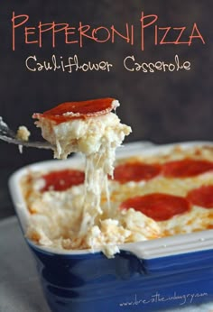 a close up of a piece of pizza being lifted from a casserole dish