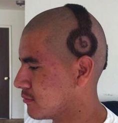 a man with a shaved head has a hair cut in the shape of a heart