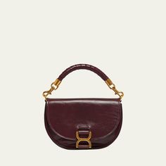 Chloe "Marcie" crossbody bag in shiny calfskin leather  Detachable top handle  Detachable chain/leather crossbody strap Can be worn as a top handle or crossbody bag  Flap top with magnetic closure  Interior, one slip pocket  Lining: Leather Approx. 6.2"H x 8.9"W x 2.8"D Made in Italy Evening Satchel Saddle Bag In Calf Leather, Evening Calf Leather Satchel Saddle Bag, Calf Leather Saddle Bag For Evening, Chic Evening Saddle Bag With Palladium Hardware, Evening Saddle Bag With Top Handle And Removable Pouch, Elegant Evening Saddle Bag With Top Carry Handle, Evening Satchel Saddle Bag With Detachable Handle, Evening Saddle Bag Satchel With Detachable Handle, Chic Saddle Bag With Detachable Handle For Evening