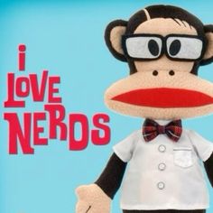 a stuffed monkey wearing glasses and a bow tie with the words i love nerds on it