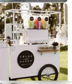 an ice cream cart with drinks on it