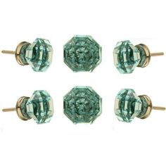 four pairs of green glass knobs with gold posts on each one and the other side